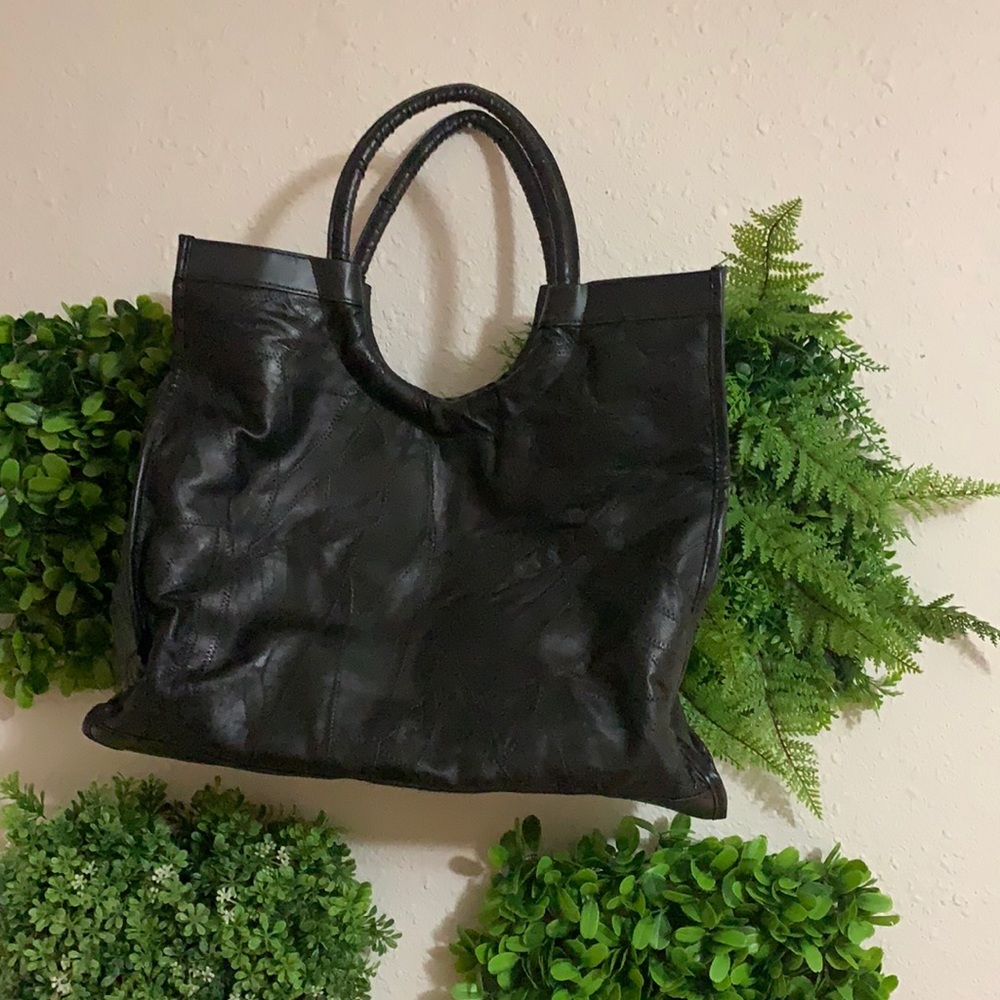 Large black faux leather tote.
